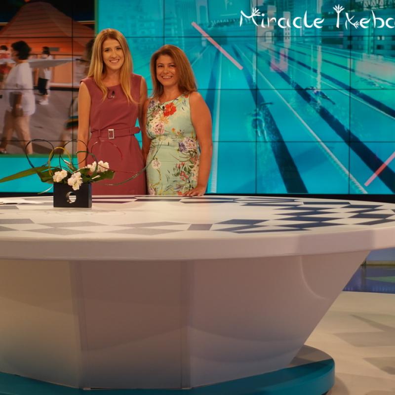 Miroslava Ivanova In Olympic Studio With Host And Ikebana Composition Logo